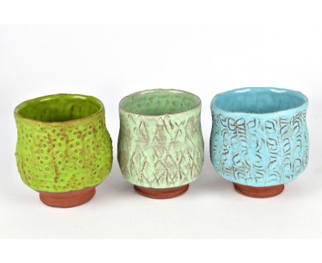 SUNSHINE COBB; a group of three earthenware yunomi, impressed mark to one, tallest 10.5cm (3).Provenance: Purchased from Scha