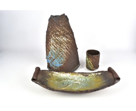 MARCIO MATTOS (born 1946); a stoneware rocking vase, long dish and tumbler, incised mark to vase, vase height 32cm, dish leng