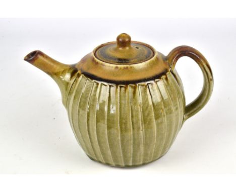 JOHN JELFS (born 1946); a fluted stoneware teapot covered in green glaze, impressed JJ and pottery mark, height 15cm. (D)Prov