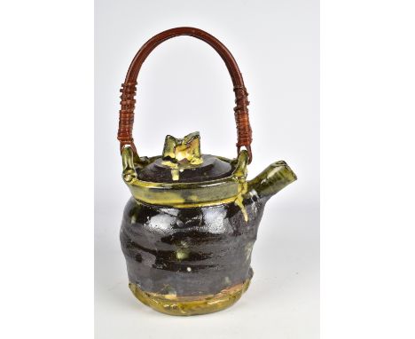 JEAN-NICOLAS GERARD (born 1954); a slipware teapot with willow handle and sgraffito decoration, incised signature, height 19.