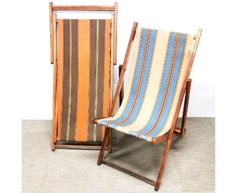 Two vintage folding deckchairs.