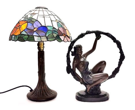 A Tiffany style table lamp, H. 43cm, together with a resin and frosted glass figural table lamp, H. 36cm.