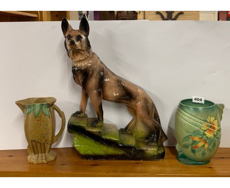 A large 1930's 'chalk' dog figure with two Art Deco ceramic items, dog H. 46cm.