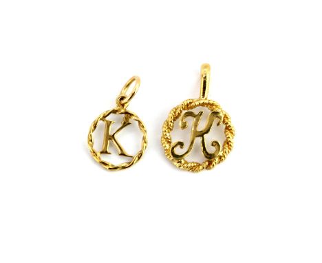 Two yellow metal (tested minimum 9ct gold) pendants of the letter 'K', largest 2 x 1.2cm.