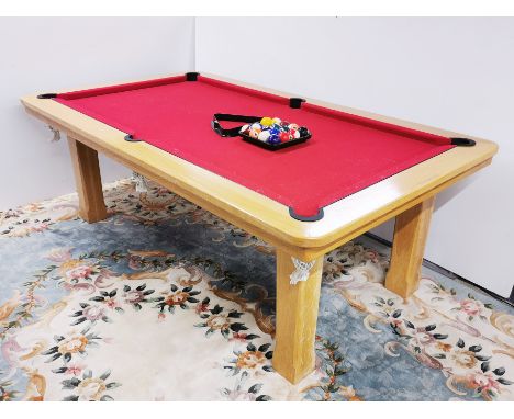 A superb light oak slate bed pool table with dining table top cover and balls, 130 x 222 x 78cm.