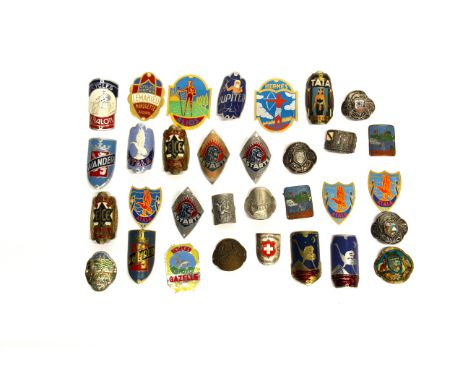 A collection of vintage metal bicycle labels.