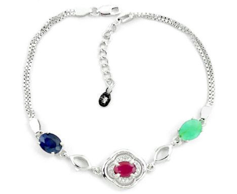 A 925 silver bracelet set with oval cut ruby, sapphire and emeralds, L. 18cm.