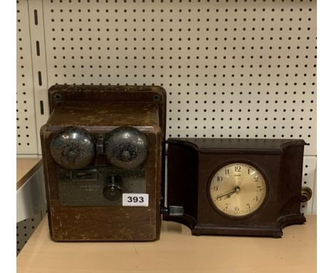 A Farrenti electric Bakelite mantle clock and telephone extension valve.