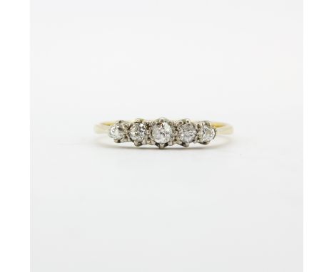 A hallmarked 18ct yellow gold (worn hallmark) ring set with five graduated old brilliant cut diamonds, (R.5).