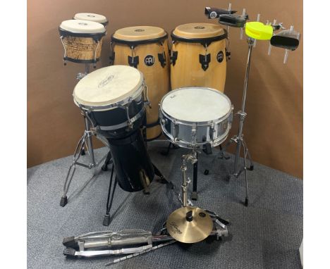 A group of percussion instruments, including Stagg and Meynell bongos and others.