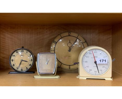 An Art Deco mantle clock and three others.