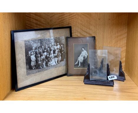 A pair of Art Deco Bakelite photograph frames, H. 16cm, together with two framed photographs.
