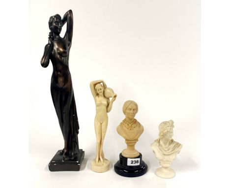An Art Deco style bronzed plaster figure and three others.