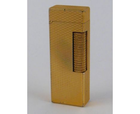 A Dunhill gold plated cigarette lighter, approx 6.5cm high.