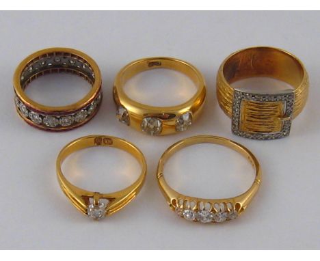 A mixed lot comprising four yellow metal (tests 18 carat gold) diamond rings, gross weight 25 gms, together with an untested 