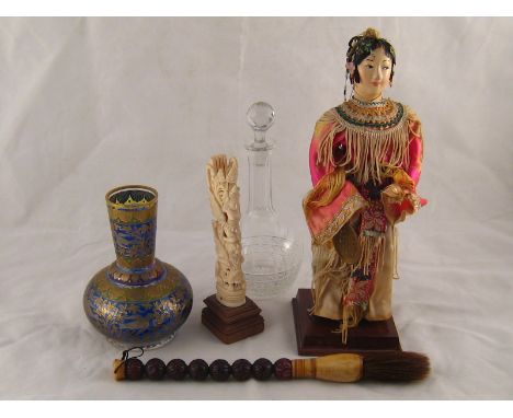 A mixed lot, an Oriental doll figure, ht.27cm., an Oriental carved bone totem figure, ht. 17cm. , a carved wood and bone Chin