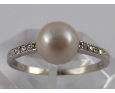 An 18 carat white gold natural pearl and diamond ring, French import hallmark, accompanied by Gem & Pearl Laboratory certific