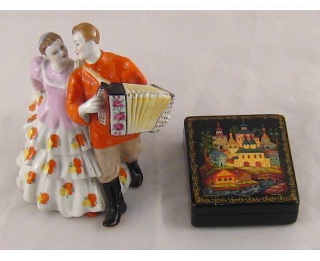 A Russian lacquered box, the hinged lid with church buildings in a landscape, signed. 8x9cm. , together with a ceramic group 