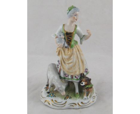 A 19th. century ceramic group of a shepherdess with lamb, sheep and dog. Impressed 447  and underglaze blue marks, possibly S