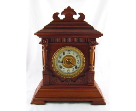 An architectural oak cased boardroom clock with eight day movement by Ansonia, gong striking, the ivory enamel chapter ring i