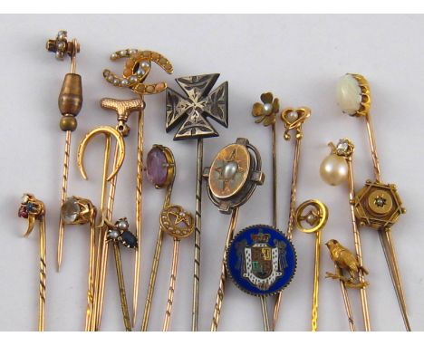 A collection of 19 untested stick pins, including antique gold and diamond set examples, gross weight 33.1 gms.