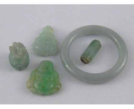 A mixed lot of jade including two carved Buddhas (approx 3cm) and a baby bangle.
