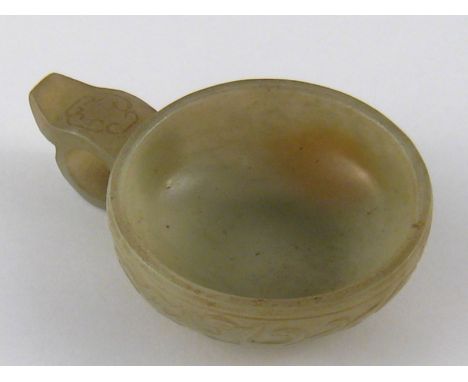 A Chinese jade cup with handle. 5cm. diameter. 