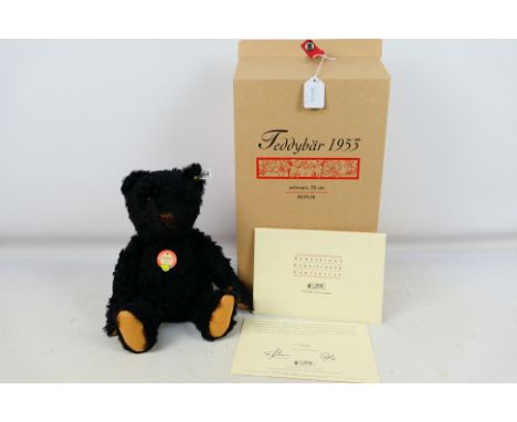 Steiff - A boxed limited edition Steiff Teddy bear 1953 in black. The mohair jointed bear is 35 cm tall filled with wood shav