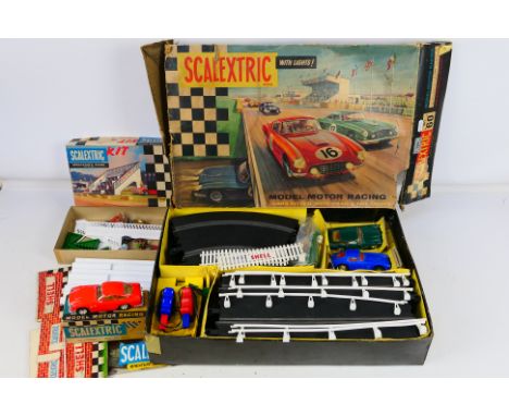 Scalextric - A vintage set number # 60 with Aston Martin DB4 and Ferrari 250 cars. Also a boxed Aston Martin DB4 # C48 and a 