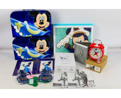 Disney - A collection of Disney memorabilia including a Mickey Mouse clock, a photo frame, a 25th Anniversary Cruise Line pri