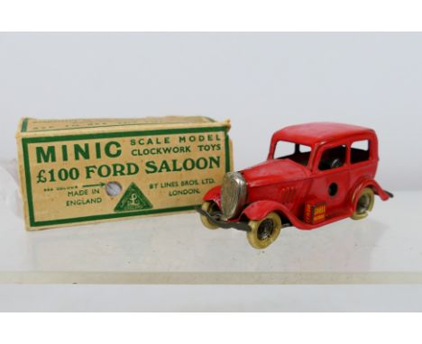 Minic - A  clockwork £100 Ford Saloon (missing key). Item appears to be in a fair-good condition with signs of use and age; d