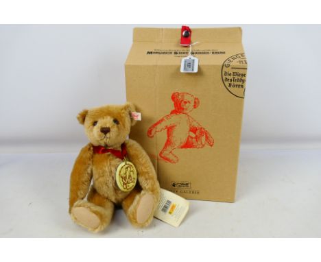 Steiff - A boxed limited edition Steiff Museum Teddy bear from 2001. The mohair jointed bear is 32 cm tall and wears a porcel
