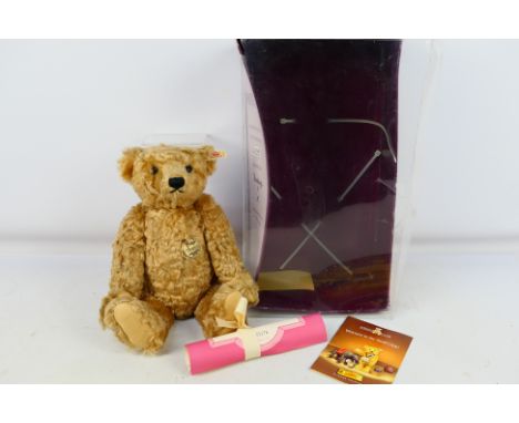 Steiff - A boxed limited edition 1997 Hamleys Winston fully jointed mohair bear. He is 38 cm tall and has a working growler a