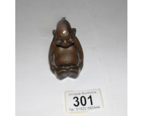 A 1920's bronze 'Biliken' cigar lighter