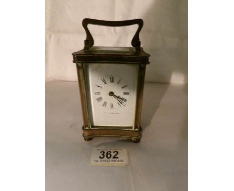 A brass carriage clock by Walter Freeman