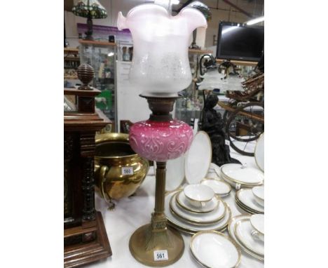 A Victorian brass column oil lamp with art nouveau pink glass font and later shade
