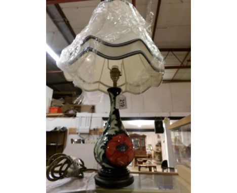 A Moorcroft lamp in poppy design by Rachel Bishop complete with Moorcroft silk shade, first quality