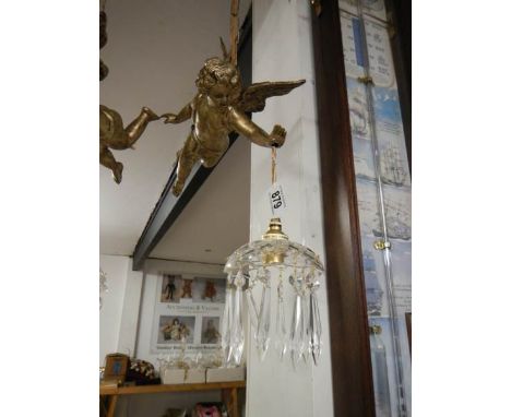 A hanging cherub ceiling light