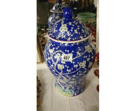 A large blue and white ginger jar