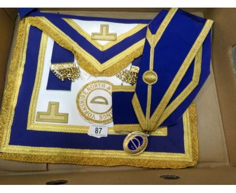 A Yorkshire North and East Riding Masonic apron, sash and silver gilt jewel