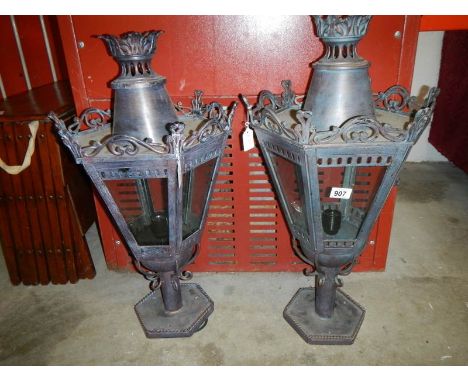 A pair of street lamp tops
 
These are modern items, in as new condition
Appear to have not been used
Height is 73cm