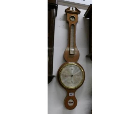 A walnut inlaid barometer