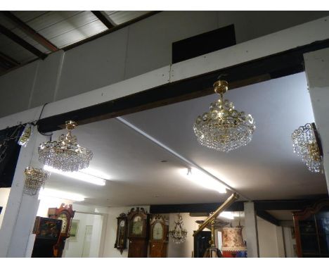A small and large ceiling light with 2 matching wall lights