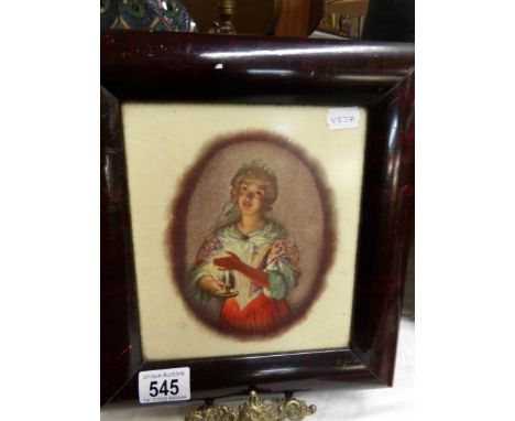 A framed hand painted portrait of a girl on ceramic plaque