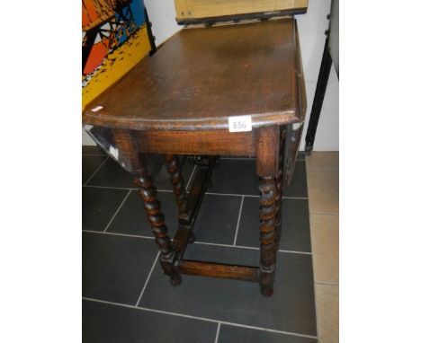 An oak barley twist gate leg table
 
Height is 72.5cm
Top 90cm x 46cm with leaves down
Top 90cm x 124cm with leaves up