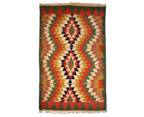 A MODERN TURKISH KELIM with a strong red, green, black and brown arrow design, approximately 255 x 175cm