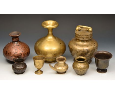A COLLECTION OF EIGHT PIECES OF MIDDLE EASTERN OR INDIAN METALWARE TO INCLUDE a baluster jar and cover with carrying handle, 