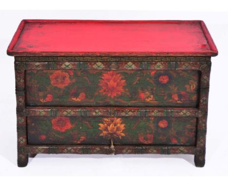 A TIBETAN PAINTED MANUSCRIPT CHEST with hinged door and polychrome foliate decoration, 71cm wide x 31cm deep x 51cm high