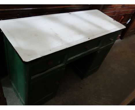 A Vintage White Enamel Topped Knee Whole Pantry Desk
