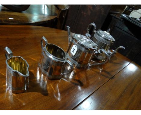 A Three Piece Plated Tea Service Together With A Further Plated Tea Pot